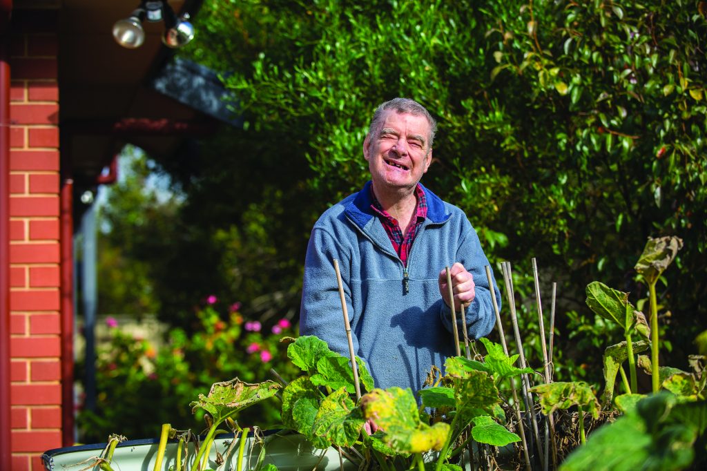 SIL client Colin enjoying some gardening out in the sun. 